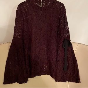 Ann Taylor Loft burgundy lace blouse. Bell sleeves with black bows. Size L.